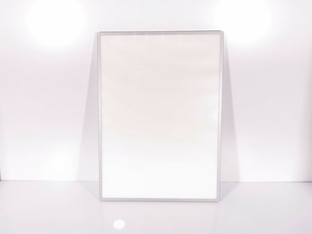 A sleek and minimalist LED Light Box A2 Silver Slim Advertising Wall Mounted Display from Eledtric stands upright against a smooth, bright background, creating a clean and modern look.